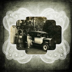 Vintage photograph of a bride, groom, and early 20th-century car, framed with ornate scrollwork.